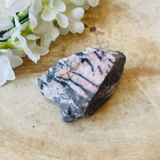 Rough rhodonite crystal